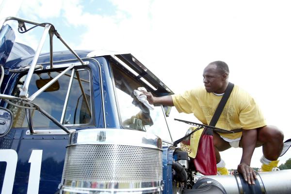 From PAUL BURGMAN-Press-Photos.com 12/06/04  - Chris Eubanks one of the Gumball participants polishes his Peterbilt Truck. The Gumball 3000 Polo Reunion Party  - (PIC PAUL BURGMAN) Contact Press-Photos.com on 07866694105