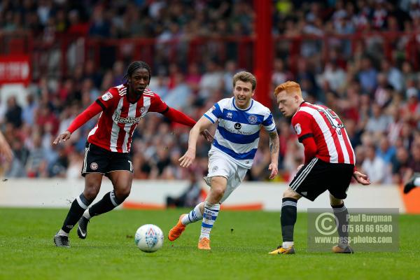 21/04/2018. Brentford v Queens Park Rangers SkyBet Championship Action from Griffin Park.  Brentford's Romaine SAWYERS & QPR’s Luke FREEMAN & Brentford's Ryan WOODS